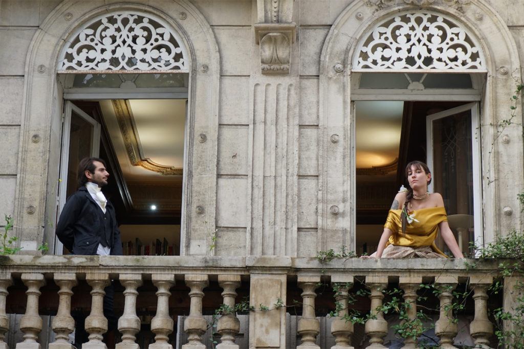 Actors pose for Nushka on the balcony of a French museum